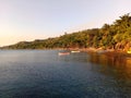 Calm sea water, blue sky and sunset on the beach at fishermen village Royalty Free Stock Photo