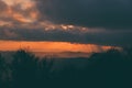 Stunning alpine landscape with golden skies and dramatic clouds