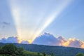 Sunset with rays of light over mountain ridge Royalty Free Stock Photo