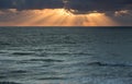 Sunset rays over ocean Royalty Free Stock Photo