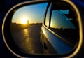 A sunset in the rearview mirror of car Royalty Free Stock Photo