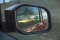 Sunset in the rearview mirror of the car Royalty Free Stock Photo