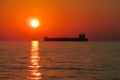 Sunset red light above the sea, ship silhouette Royalty Free Stock Photo