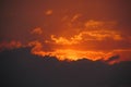 Sunset red light through the clouds Royalty Free Stock Photo