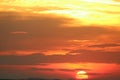 sunset on red yellow sky back soft evening cloud over horizon sea Royalty Free Stock Photo