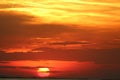 Sunset on red yellow sky back soft evening cloud over horizon sea Royalty Free Stock Photo