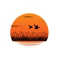 Sunset. Reeds, sedge. Ducks and geese are flying. Vector logo, emblem