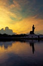 Sunset and reflaction Buddha statue, Thailand Royalty Free Stock Photo