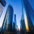 Sunset reflected off modern glass facades of Busy modern city life buildings in morning Royalty Free Stock Photo