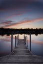 Sunset Reflected Under Wood Dock