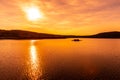 Sunset reflected in water. Josefuv Dul Dam, Jizera Mountains, Czech Republic