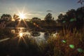 The sunset is reflected in the water of the lake in Serebryany Bor, Moscow, Russia. Royalty Free Stock Photo