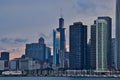 Sunset reflecting off of skyscrapers, with view of sailboats in a Lake Michigan marina in foreground, along Lake Michigan`s lakefr Royalty Free Stock Photo