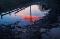 Sunset reflecting on puddle