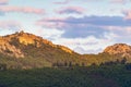 Sunset reflecting the sunlight on the mountain with green trees with some cloud, in CÃÂ¡ceres, in Spain. Europe.