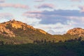 Sunset reflecting the sunlight on the mountain with green trees with some cloud, in CÃÂ¡ceres, in Spain. Europe.