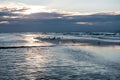 Sunset with reflection on the beach of Koksijde, Belgium