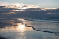 Sunset with reflection on the beach of Koksijde, Belgium