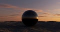 Sunset reflection on a glossy black metallic sphere Royalty Free Stock Photo