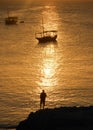 Sunset reflection man boats orange portrait Royalty Free Stock Photo