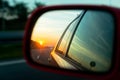 Sunset reflection in the rear view mirror Royalty Free Stock Photo