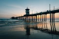 Sunset reflections and the pier in Huntington Beach, Orange County, California Royalty Free Stock Photo