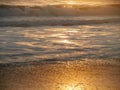 Sunset Reflections on the Waves and Sand Royalty Free Stock Photo