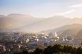 A sunset in a resort town of Beppu, Japan, with a view of mountains embracing the city and layers of sun. Royalty Free Stock Photo