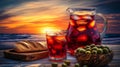 During sunset, a restaurant served a pitcher of sangria, two glasses, and various side dishes Royalty Free Stock Photo