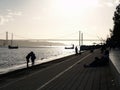 Lisbon, Portugal: August 14, 2019: People relaxing by the river on a sunset hour in mids summer before pandemic. Royalty Free Stock Photo