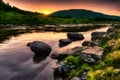 beautiful orange sunrise river landscape with stone around it Royalty Free Stock Photo