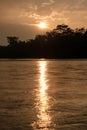Sunset on a river in the amazon rainforest Royalty Free Stock Photo