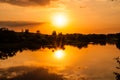 Sunset on the river Berezina with the reflection of the sun in the water Royalty Free Stock Photo