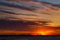 Sunset on the river. Colorful landscape with river and blue sky with multicolored clouds. River sunset panorama Royalty Free Stock Photo