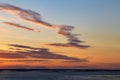 Sunset on the river. Colorful landscape with river and blue sky with multicolored clouds. River sunset panorama Royalty Free Stock Photo