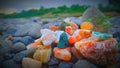 Sunset on river side with color stones