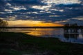 Sunset on the river with three trees on Desna river in springtime, Ukraine. Royalty Free Stock Photo