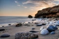 Sunset rocks on beach Royalty Free Stock Photo