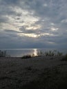 Sunset Rocks Lake trees pebbles waves water sky clouds vegetation beach evening view scenic