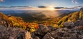 Sunset in a rocky forest landscape with autumn nature. Stiavnicke hill, Sitno, Slovakia