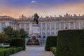 Sunset by the Royal Palace or Palacio Real with king Philip IV statue in Plaza de Oriente in Madrid Spain built in 1639