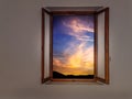 Sunset through rustic wooden window. Europe. Colorful. Could also be new dawn