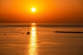 Sunset sail unfurls along the idyllic Omis Riviera, Adriatic Mediterranean Sea. Dramatic hues paint the sky as a romantic day