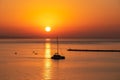 Sunset sail unfurls along the idyllic Omis Riviera, Adriatic Mediterranean Sea. Dramatic hues paint the sky as a romantic day