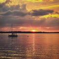 Sunset with Sailboat and Clouds on Geneva Lake in Wisconsin Royalty Free Stock Photo