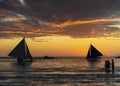 sunset with sailing boats and tourists in boracay island philippines Royalty Free Stock Photo