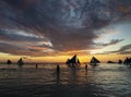 sunset with sailing boats and tourists in boracay island philippines Royalty Free Stock Photo