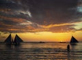 sunset with sailing boats and tourists in boracay island philippines Royalty Free Stock Photo