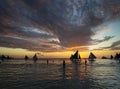 sunset with sailing boats and tourists in boracay island philippines Royalty Free Stock Photo