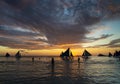 Sunset with sailing boats and tourists in boracay island philippines Royalty Free Stock Photo